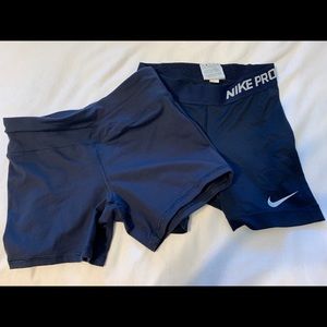 2 pairs navy blue spandex (size xs)